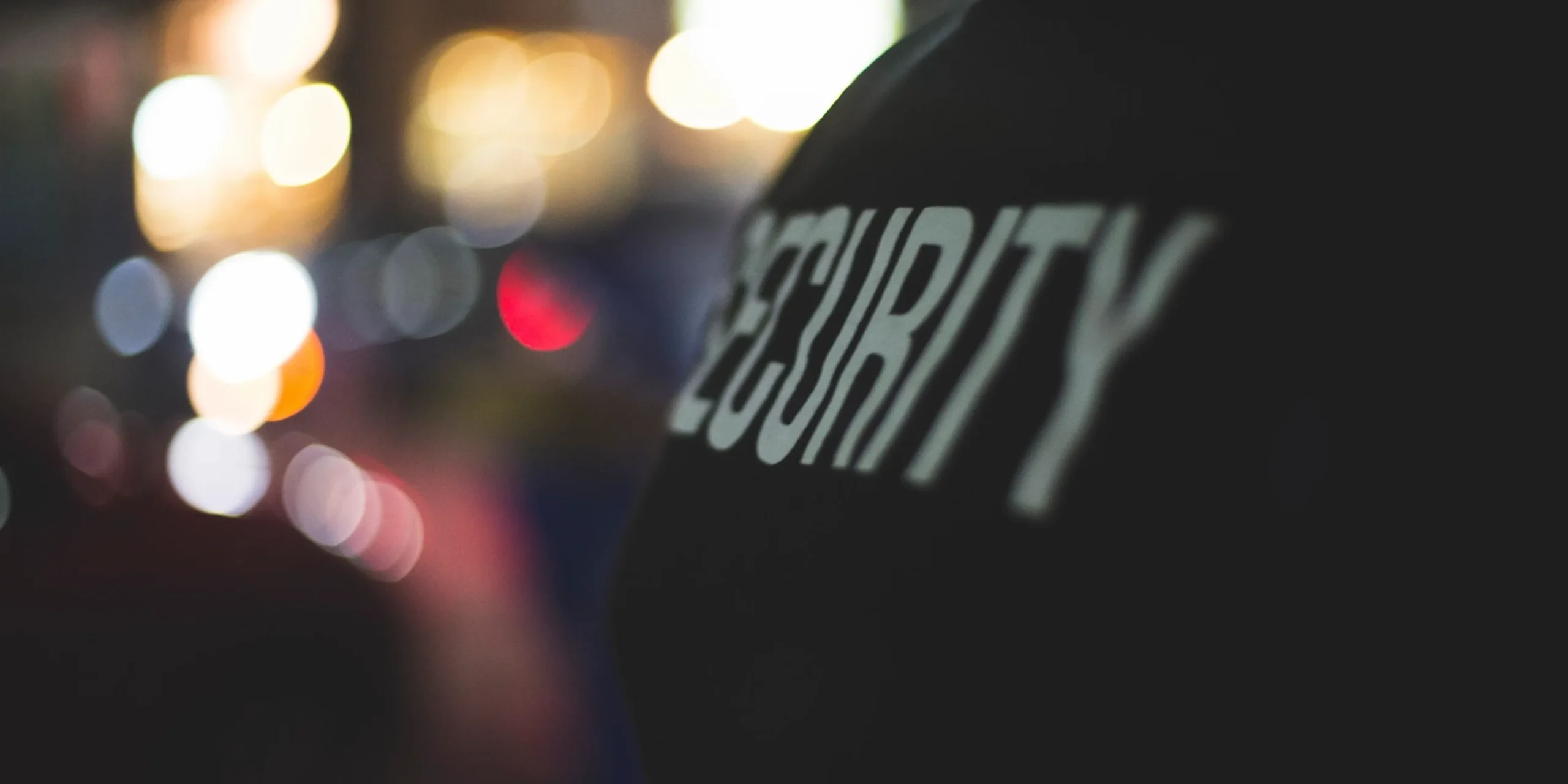 A Security Personal With A Security Jacket